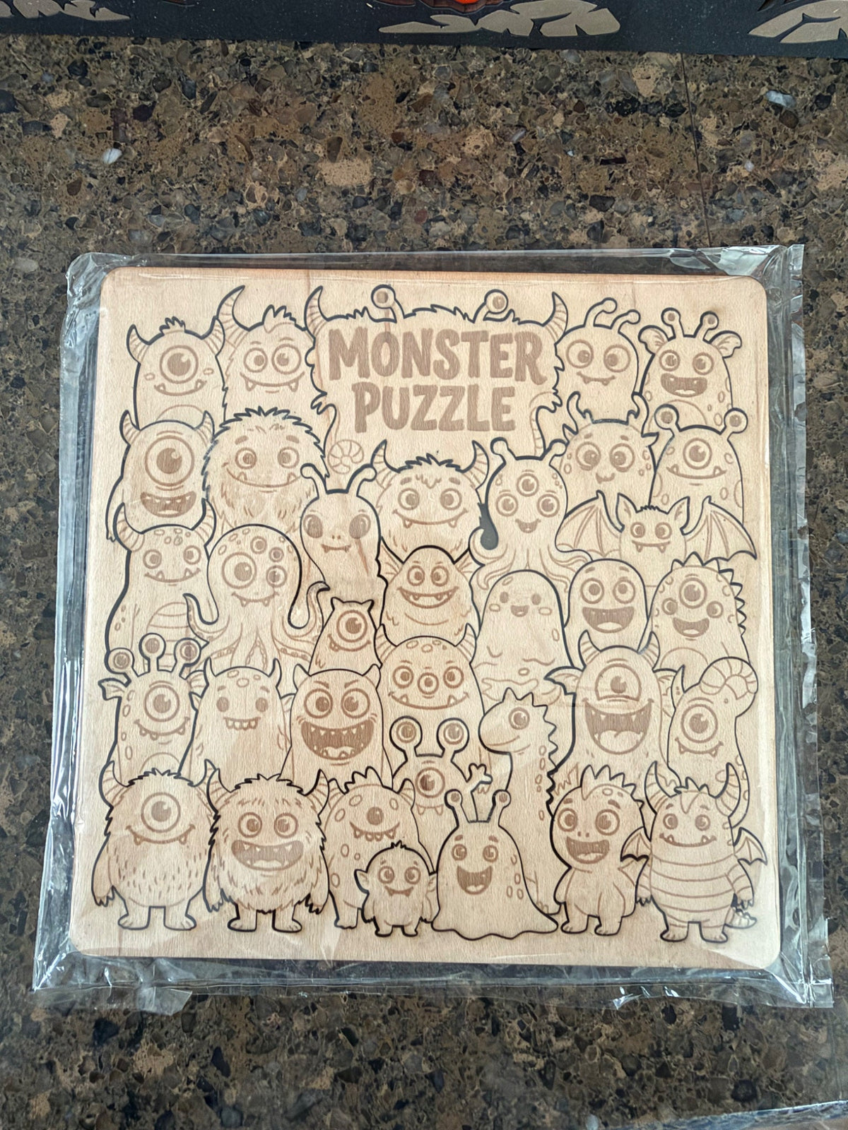 Laser cut maple Monster Puzzle with character-shaped pieces