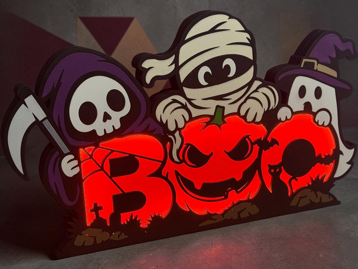 Light-up BOO Halloween sign with skeleton, mummy, ghost and glowing jack-o-lantern letters