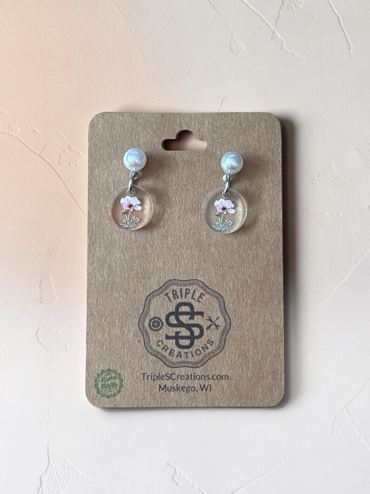 October Cosmos birth flower earrings with pearl studs on a Triple S Creations card